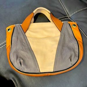OrYany hobo bag. Tri color leather. Does not come with shoulder strap.